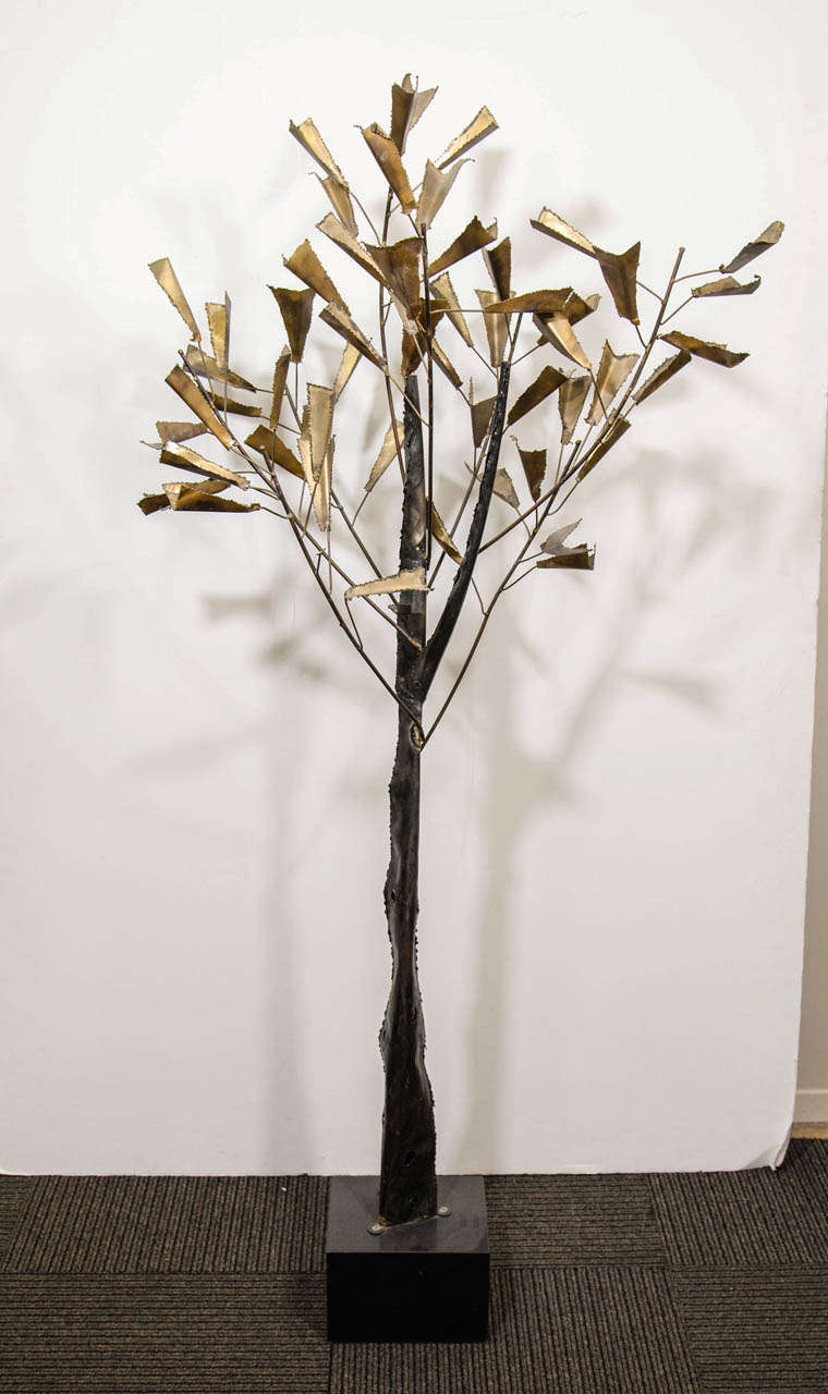 A vintage tree form sculpture standing sculpture made comprised of brass leaves and designed by Curtis Jere.

Good vintage condition with age appropriate wear.  A few brass leaves are missing.

Reduced from: $1800