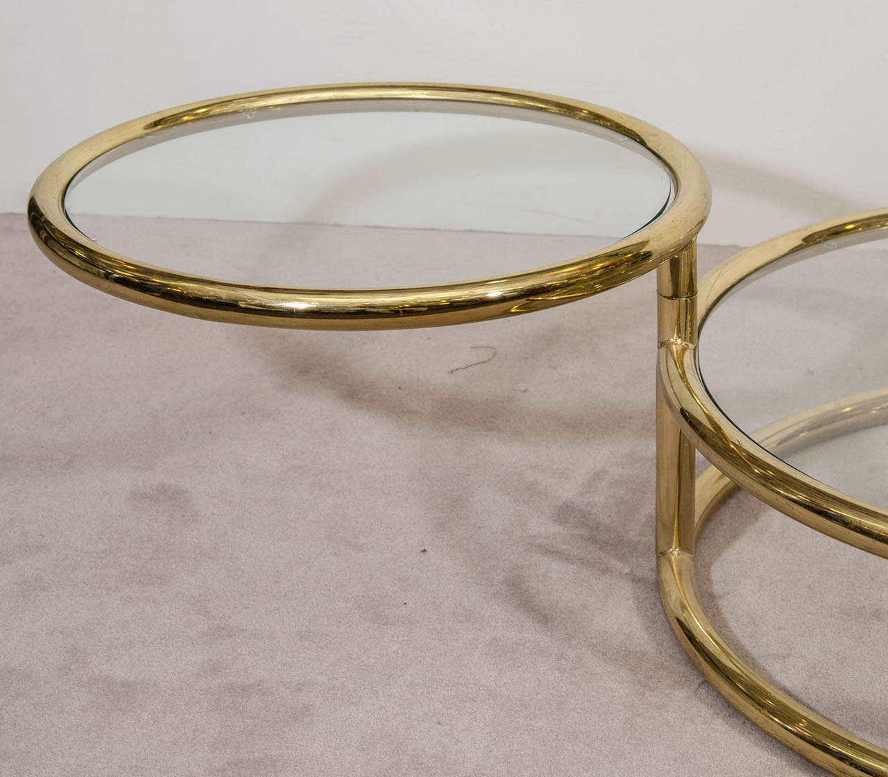 A Mid Century Milo Baughman Style Three Tiered Brass and Glass Swivel