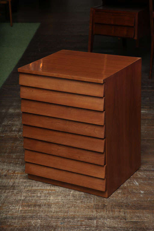 5 drawer chest of walnut veneer. Perfectly sized for bed/ chair/ or sofa side.  A great example of Gibbings' early work from the 1940's and his transitional period from completely custom work into production pieces for Widdicomb.