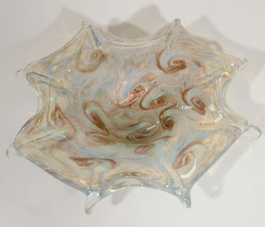 This stylized octagon bowl features swirls of 24k gold throughout  a pale grey backround. It also has the original sticker on it saying its Murano Italy