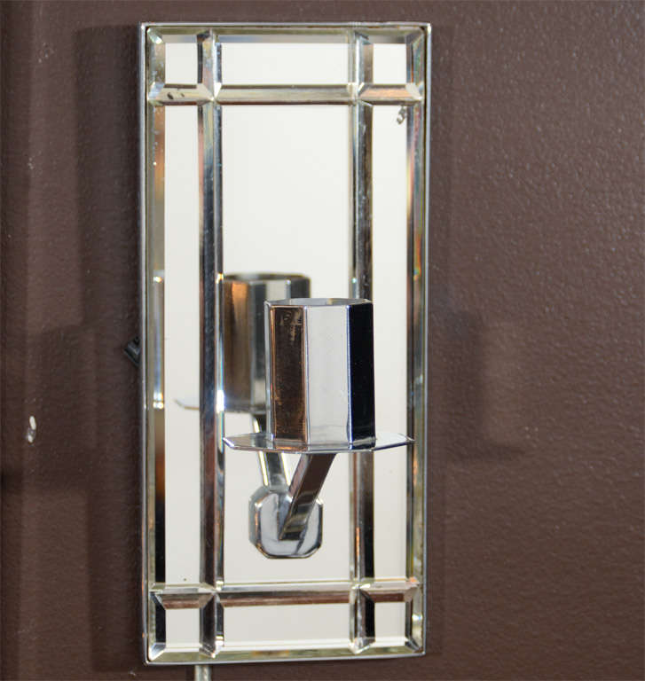 These gorgeous sconces features hand cut beveled emerald cut detailing with chrome fittings. They are completely rewired.