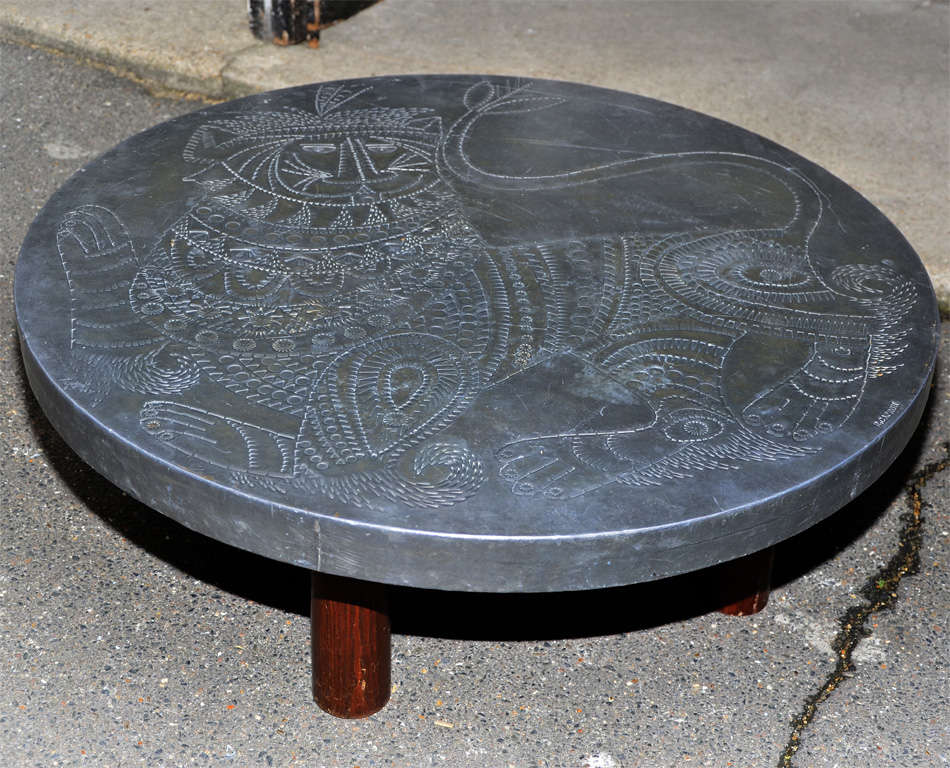 Rare 1970s coffee table with hand-worked lead top by Jean Derval after a drawing by Roger Capron; on wooden legs. Signed by Roger Capron.