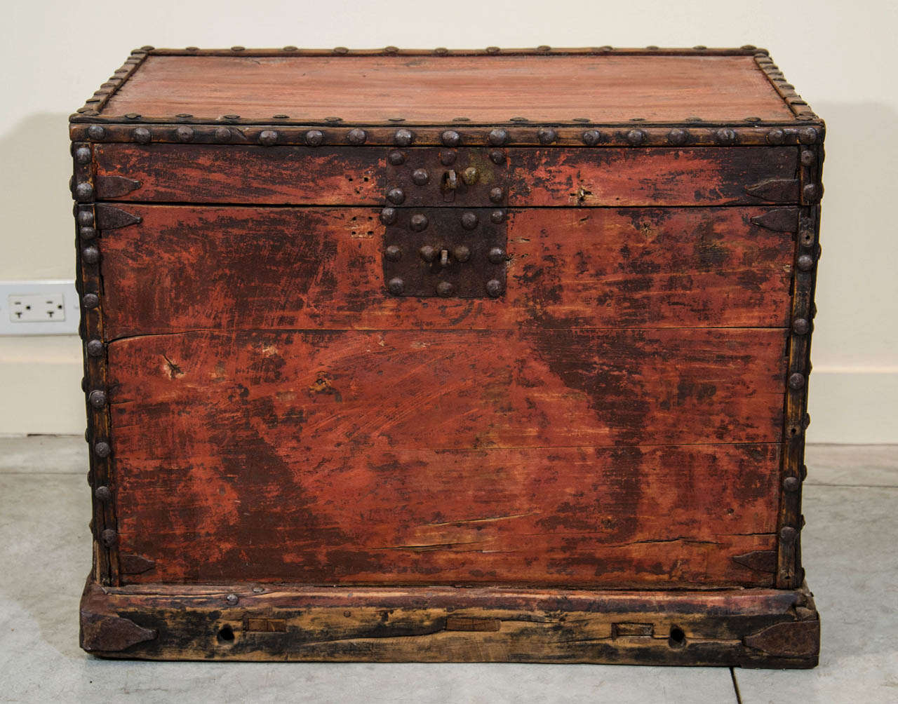 A 19th Century Chinese wardrobe trunk with sturdy original cast iron hardware. A beautifully faded red.  From Shanxi Province, c. 1850.
CST361