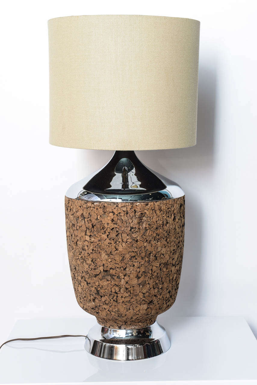 Fabulously retro, this chrome table lamp has a unique cork veneer over its lower half.    Give a side table a Mad Men look in an instant with this lamp.