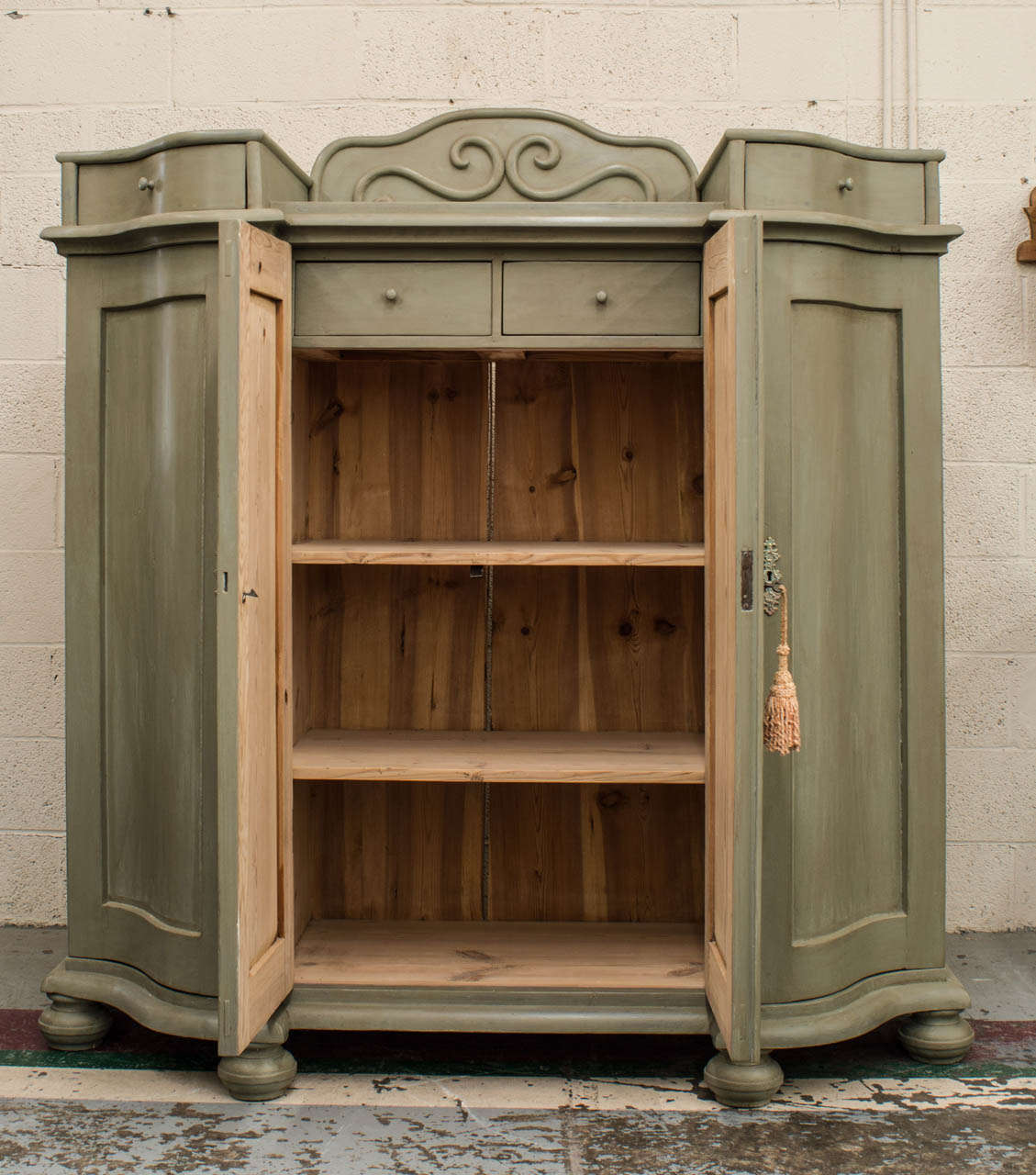 An outstanding Swedish serpentine pitch pine side cupboard of superb quality featuring two central paneled doors flanked by two serpentine side doors with matching drawers above.  Two interior drawers in the centre section with two morticed-in