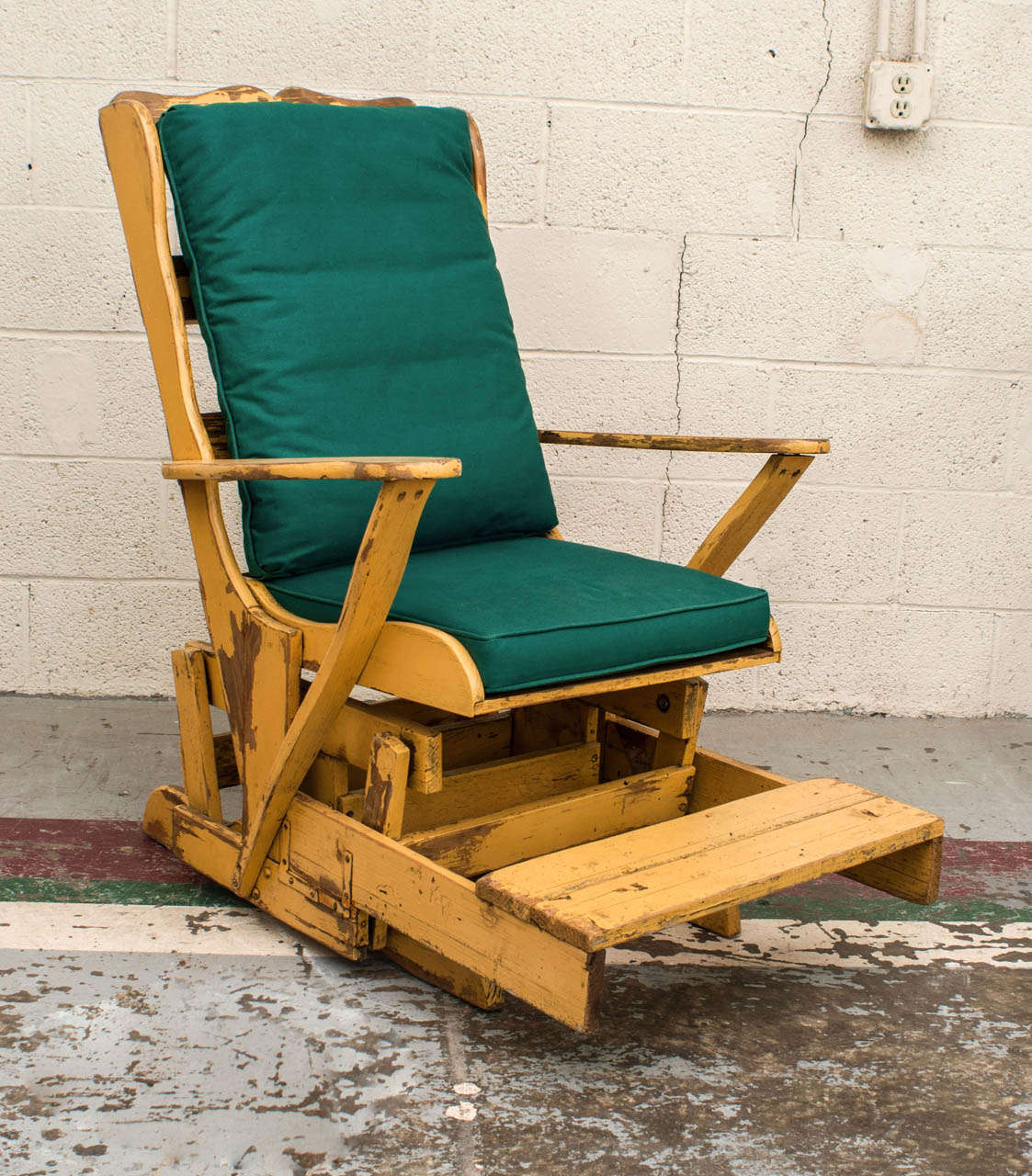A beautiful and unusual beechwood glider in wonderfully distressed original mustard paint featuring a slatted seat and back and with a very smooth action.  Great for relaxing in a covered porch. New cushions included.