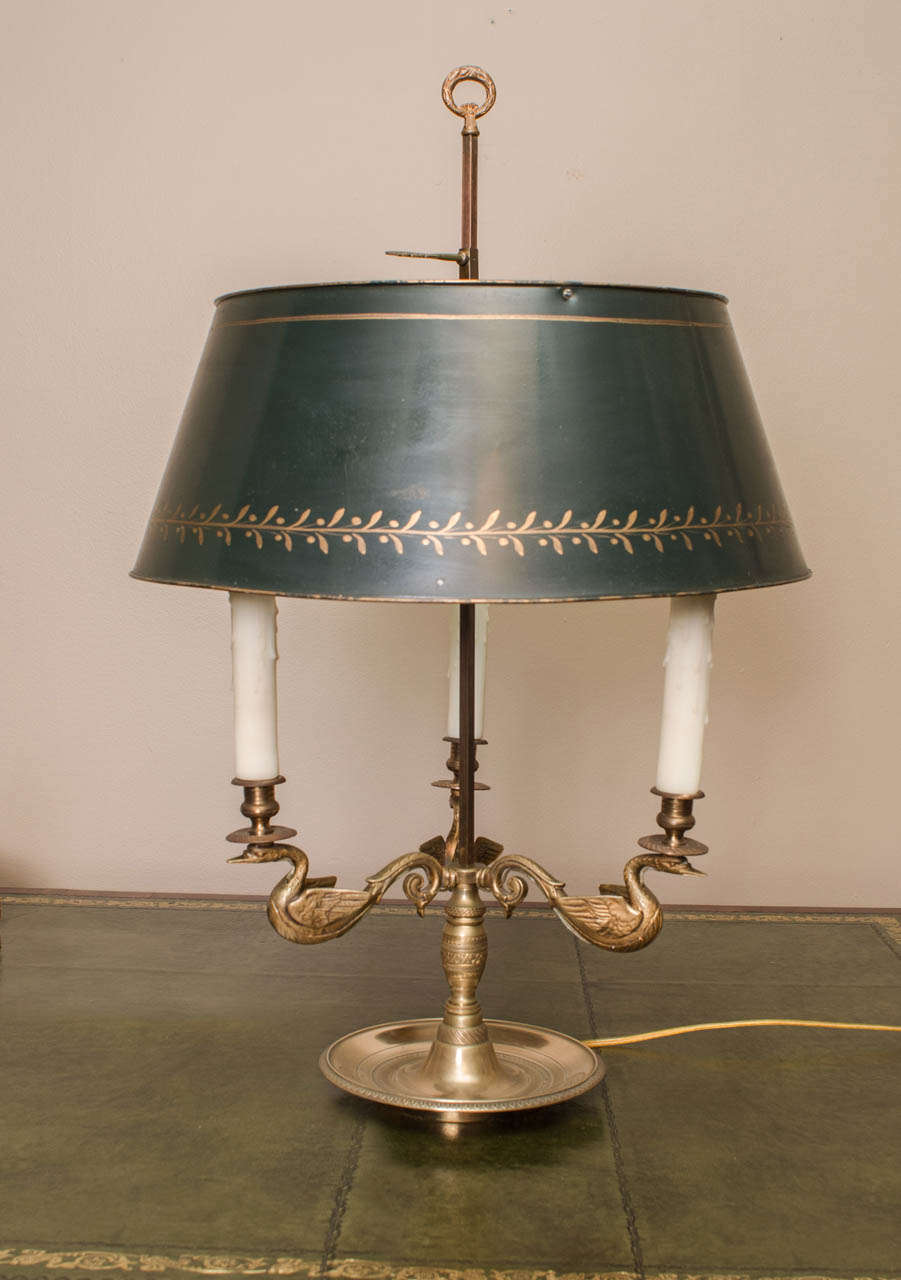 Beautiful hand-cast brass lamp with lovely patina and tole shade. Swan motif.