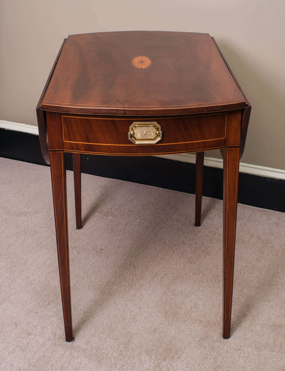 This Hepplewhite-design one-drawer dropleaf table was made by a master cabinetmaker probably in  Rhode Island - the proportions are excellent - the bowed ends with the leaves up make a beautifully proportioned oval top (31.75
