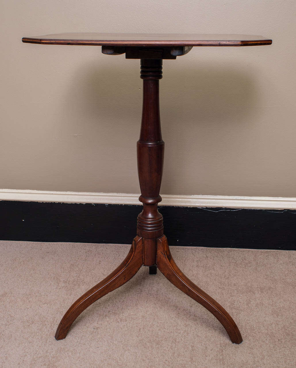 A charming table with an excellent patina - canted corners - inlay on top and feet - good turning on the pedestal.