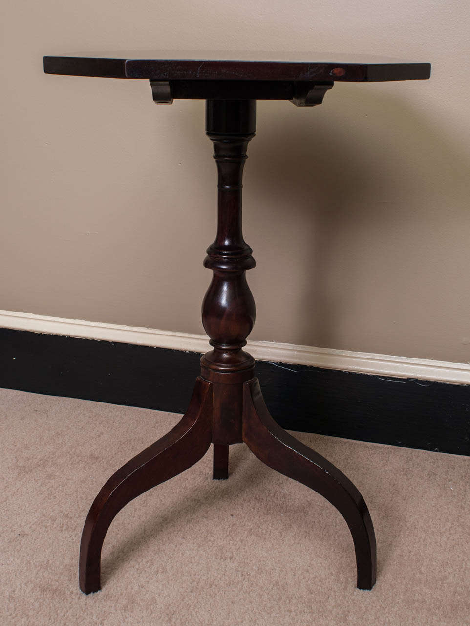 This stand was probably made in the coastal South, the turning of the pedestal and the proportions of the cyma curve legs all point to a cabinet maker from Norfolk or further South. The table was, at some point, from Mt. Mourne Plantation, Iredel
