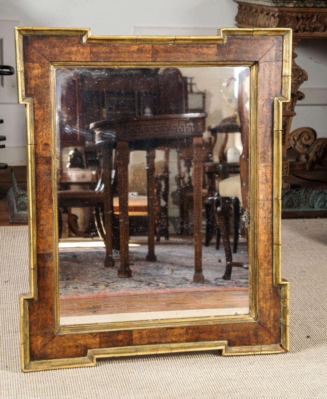 Nice English early 19th century mirror. Frame with burl-Walnut and gilded borders. Original mirror plate. Circa 1830.