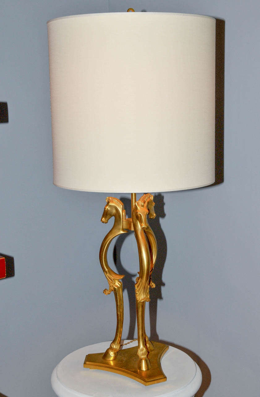 1970's gilded bronze table lamp. New shade. Three light bulbs. Wired for European use.  Good condition. Normal wear consistent with age and use.