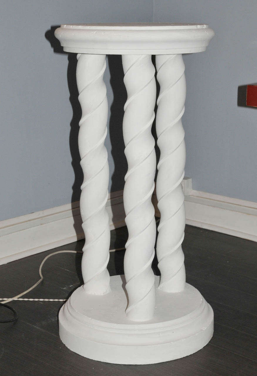 Pair of 1960's spiral pedestals or columns in white plaster. Good condition. Normal wear consistent with age and use.