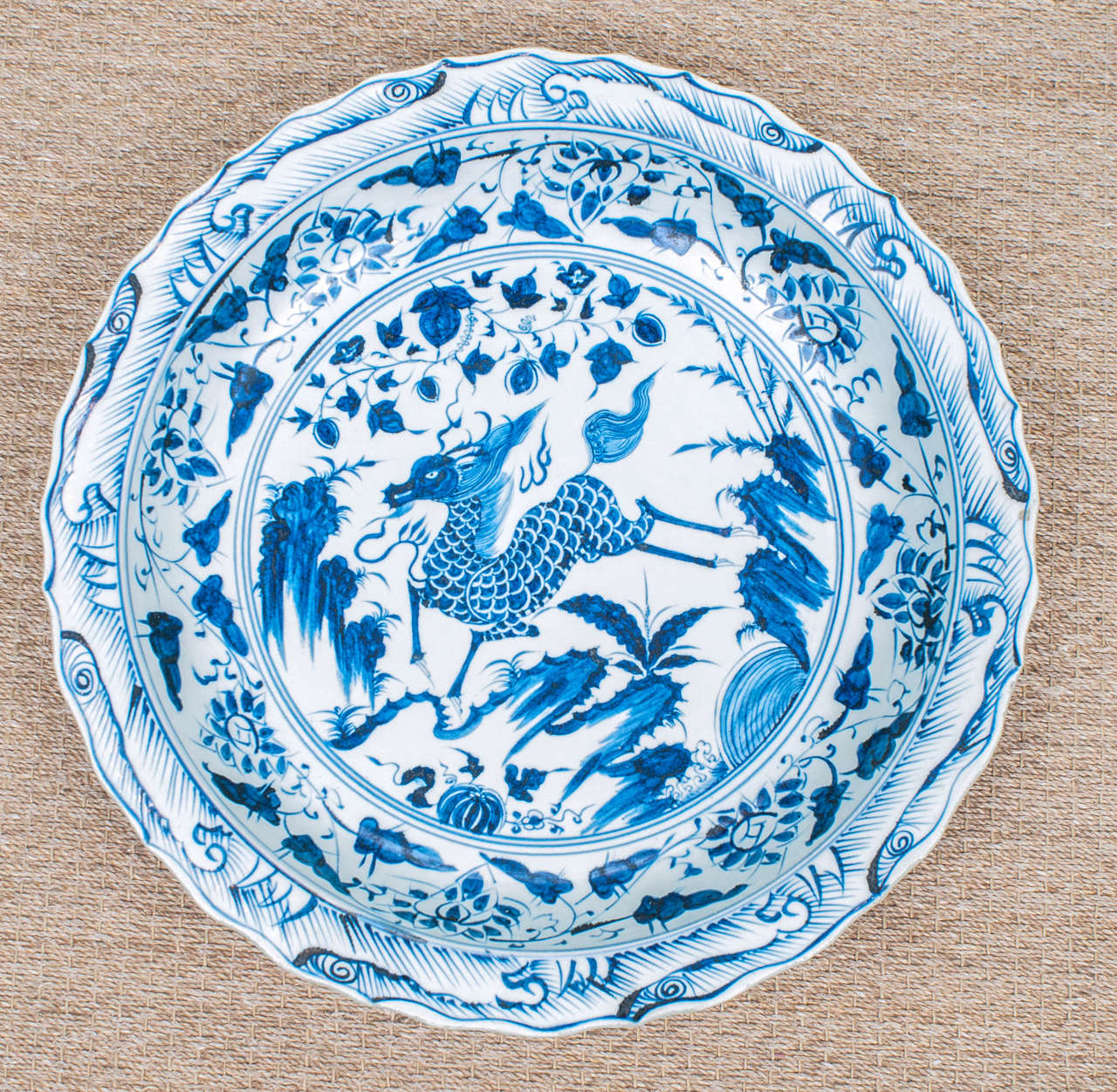 Stately Chinese charger expertly hand painted with mythical animal motif. From the Jingdezhen region of China, home of the Imperial kilns of the emperors.