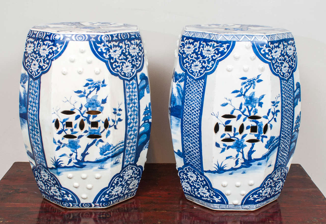 Pair of Chinese garden seats with floral and landscape motif in an octagonal shape.