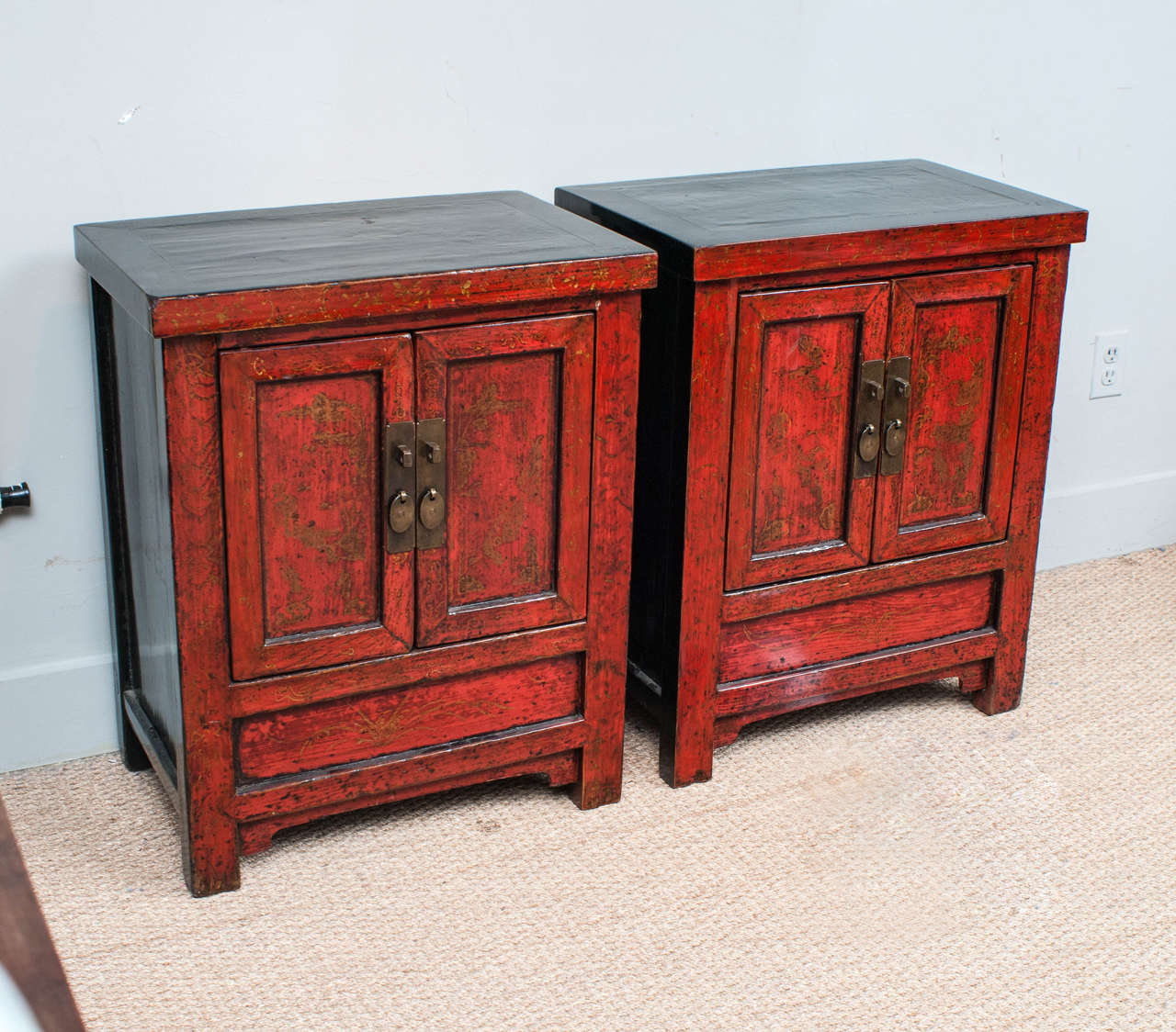 Exquisitely conserved original lacquer with subtle traces of hand painting on the doors. Perfect as bedside chests or end tables.