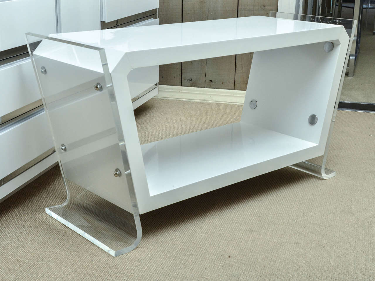 Attractive and unusual Mid-Century white lacquer console or TV Stand with Lucite sides.