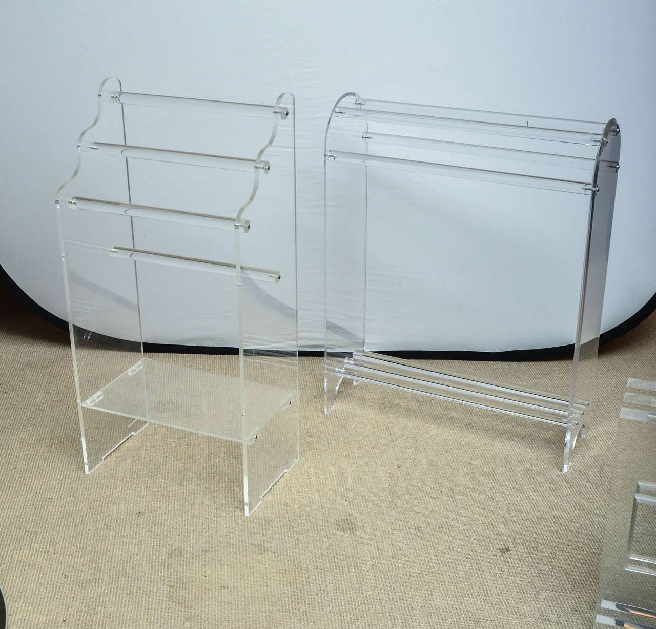 Two mid-century Lucite towel racks. The other rack measures 31.5H x 24.5W x 9D
