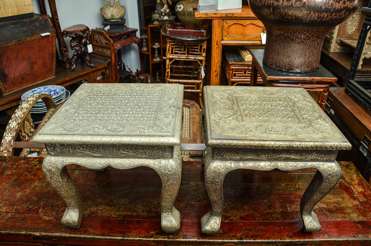 Turn of the century Indian hammered silver side table (two available, priced and sold separately).