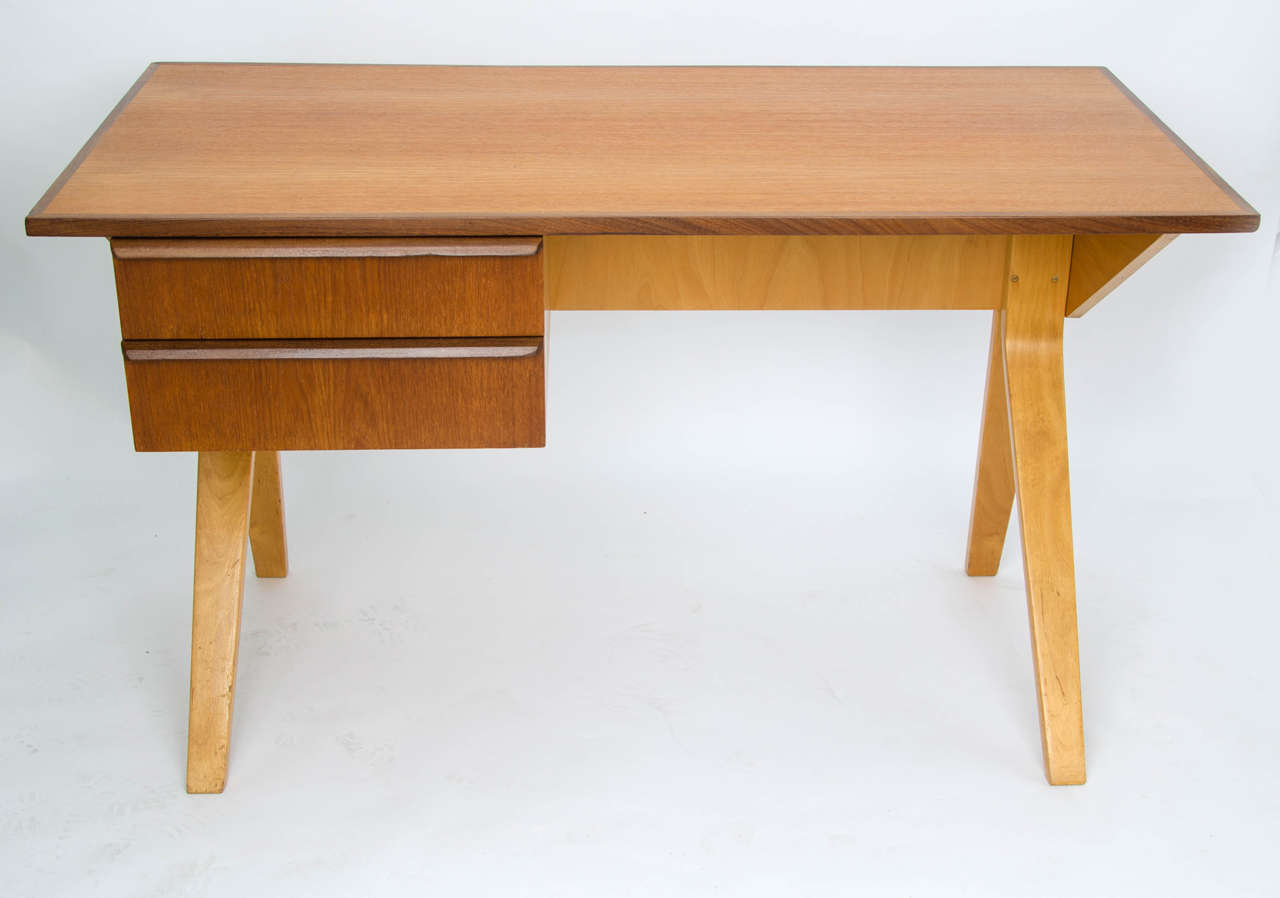 Bent ply desk - model EB02 - by Cees Braakman for Pastoe.  Netherlands 1950s.

This model, part of the birch series, is a special edition with teak top and drawer fronts and details in afromosia.  The desk has two drawers with bent ply liners to