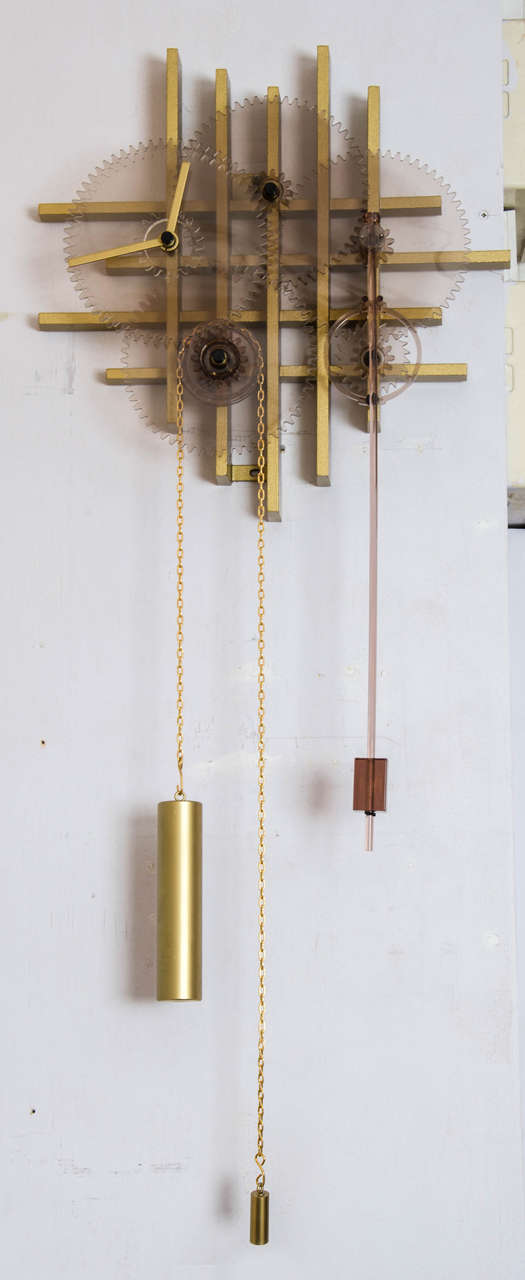 Unique skeleton clock exposes the working mechanism in Perspex, metal and brass.