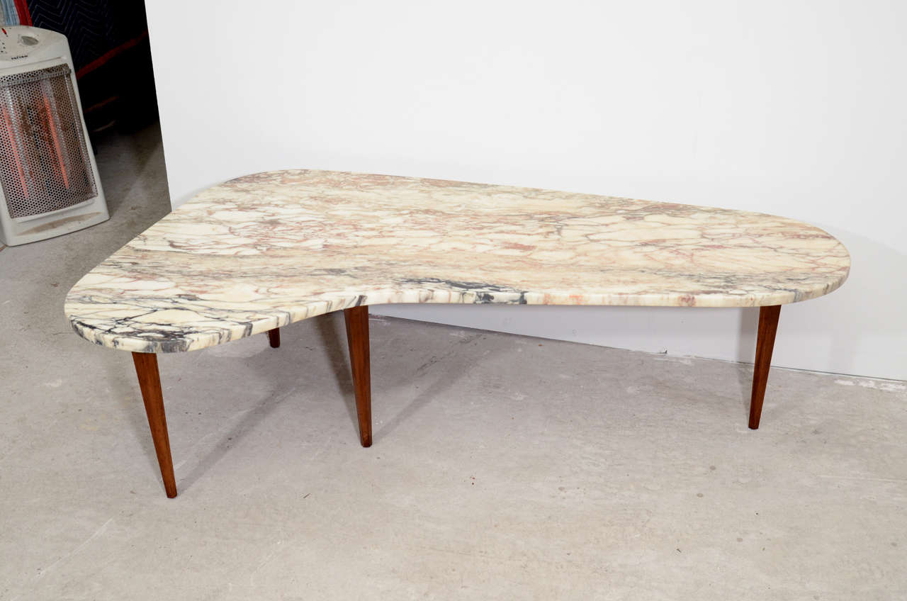 US mid century biomorphic solid mahogany coffee table with marble top.