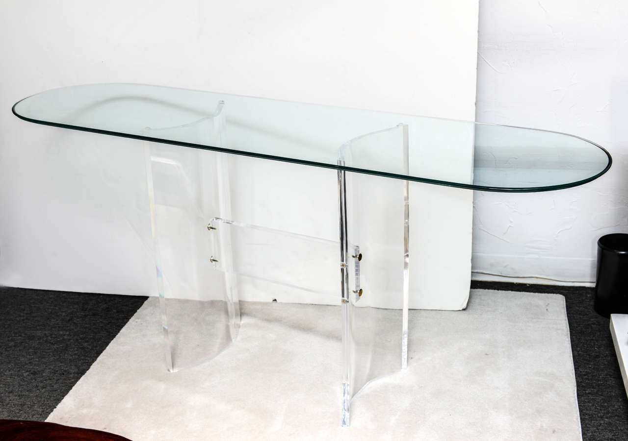 This strong and simple design makes this base versatile for a console table or dining table.  Slightly concave Lucite pieces sturdily buttressed in the middle. Beautiful classic line for any interior. 
(Price for the glass on demand)

