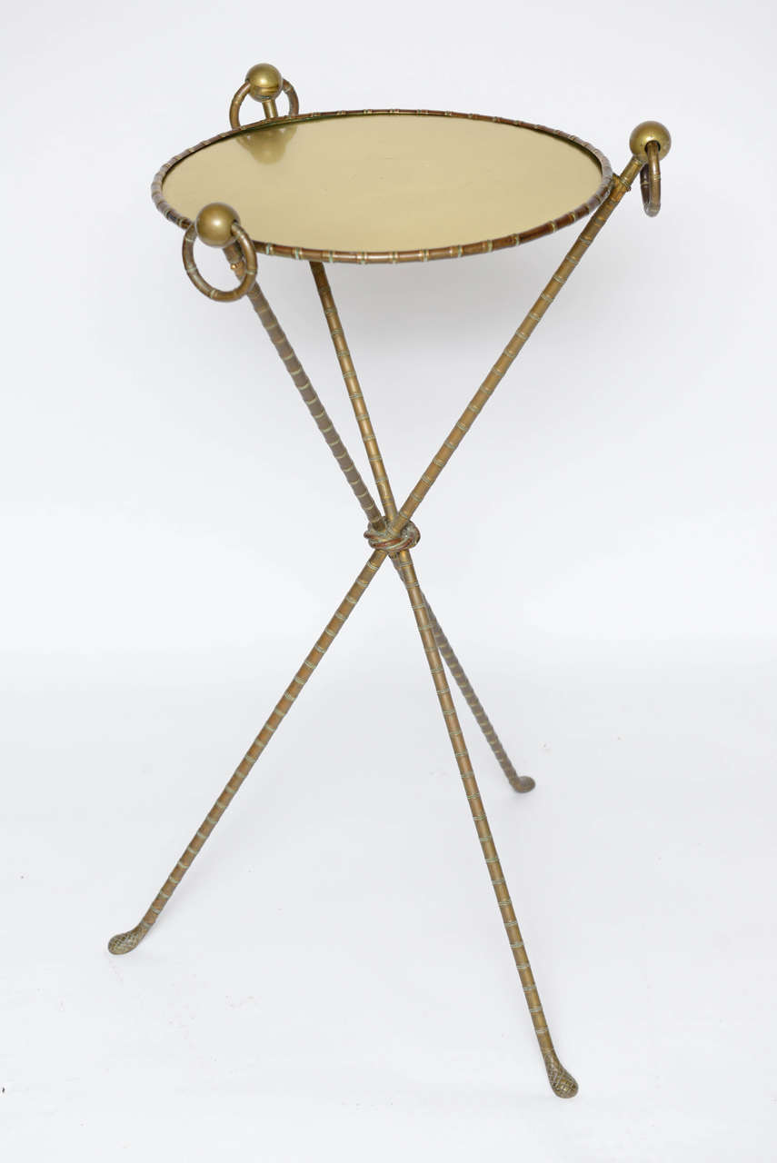 16" diameter of tray. This brass faux bamboo side table has wonderful touches that distinguish it.