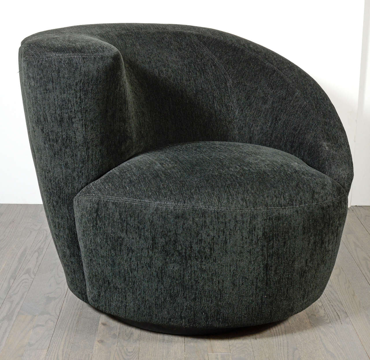 This pair of sculptural Modernist asymmetrical swivel chairs by Vladimir Kagan, newly upholstered in a lux black velvet fabric.