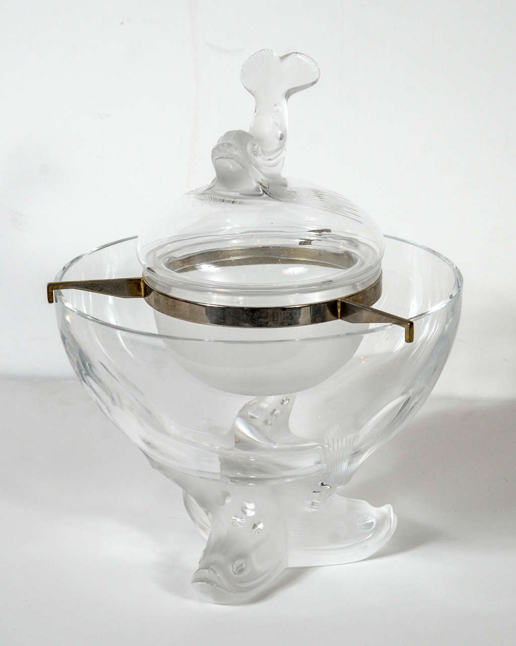 This clear and frosted glass Caviar dish by Lalique features a figural dolphin tripod ice base with insert Caviar bowl with silvered supports and a chic finial on the lid.