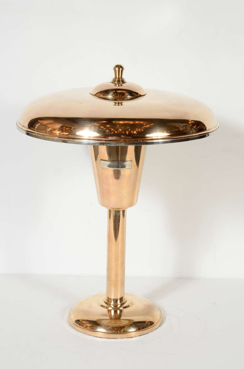 This Art Deco desk lamp in copper and brass features a domed canopy over a tapered fitting with a monogram plate . Newly rewired.