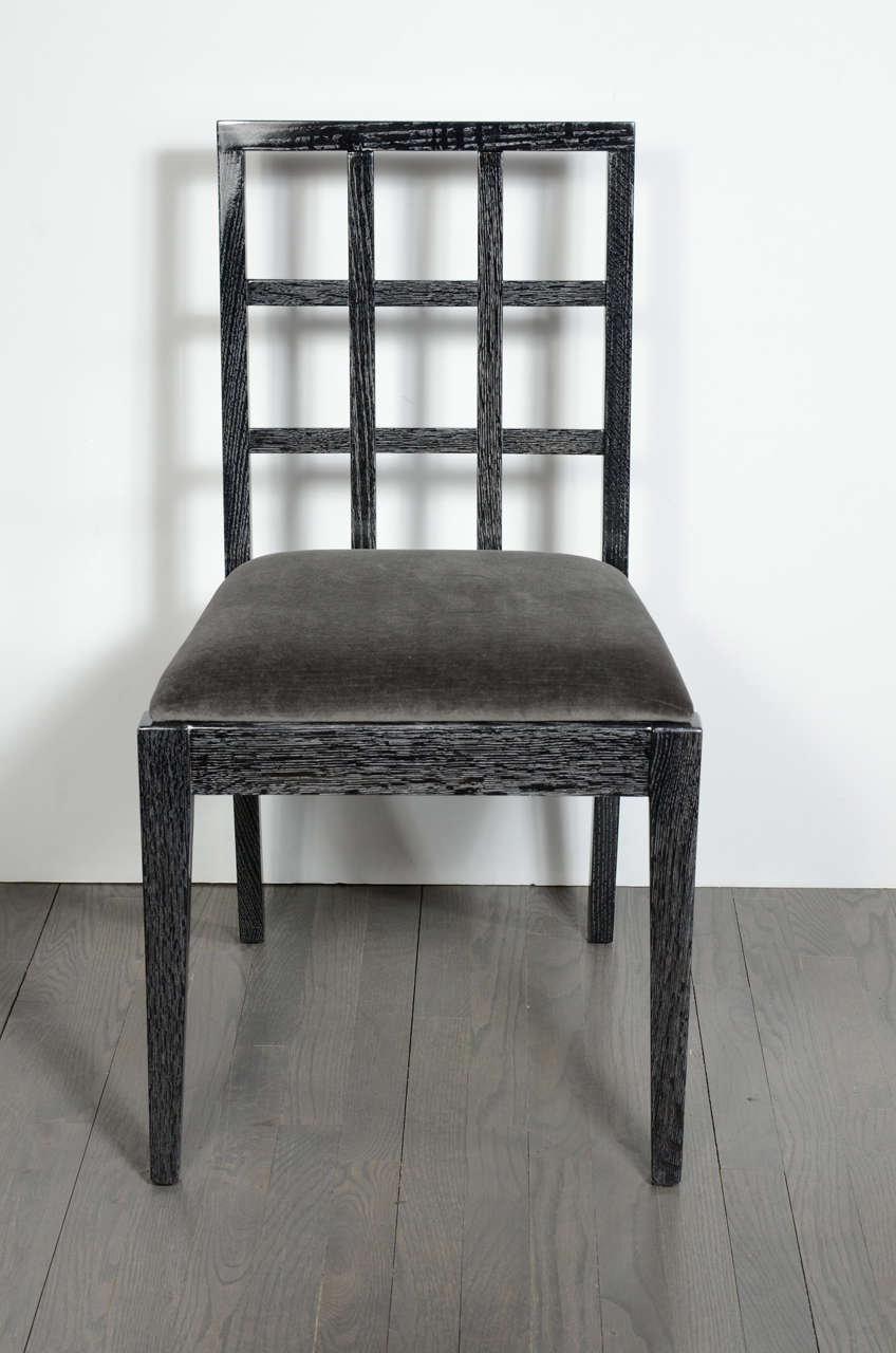 Exceptional modernist dining chairs in a beautiful silver cerused oak finish.These chairs have a very modern design and have been reupholstered in a pewter velvet.These chairs were custom designed by Eugene Schoen,acquired from one of several homes