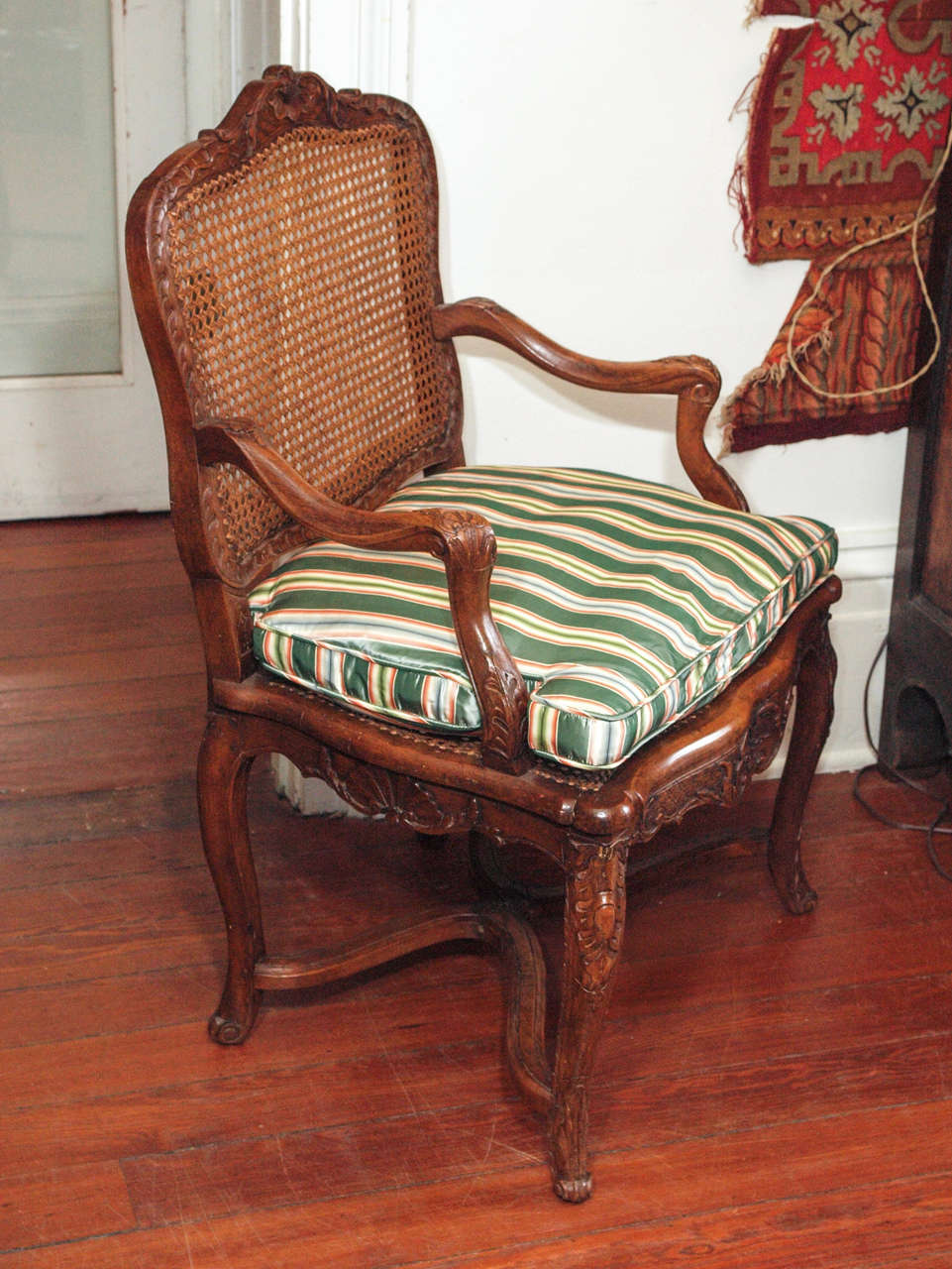 Pair of French Regence Walnut Cane seat and back Armchairs