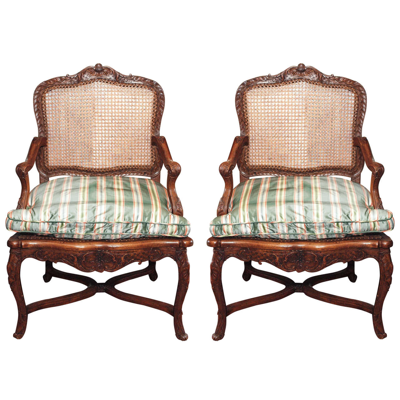 Pair of French Walnut Regence Cane Armchairs For Sale