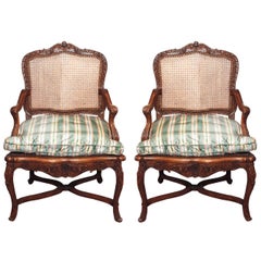 Pair of French Walnut Regence Cane Armchairs