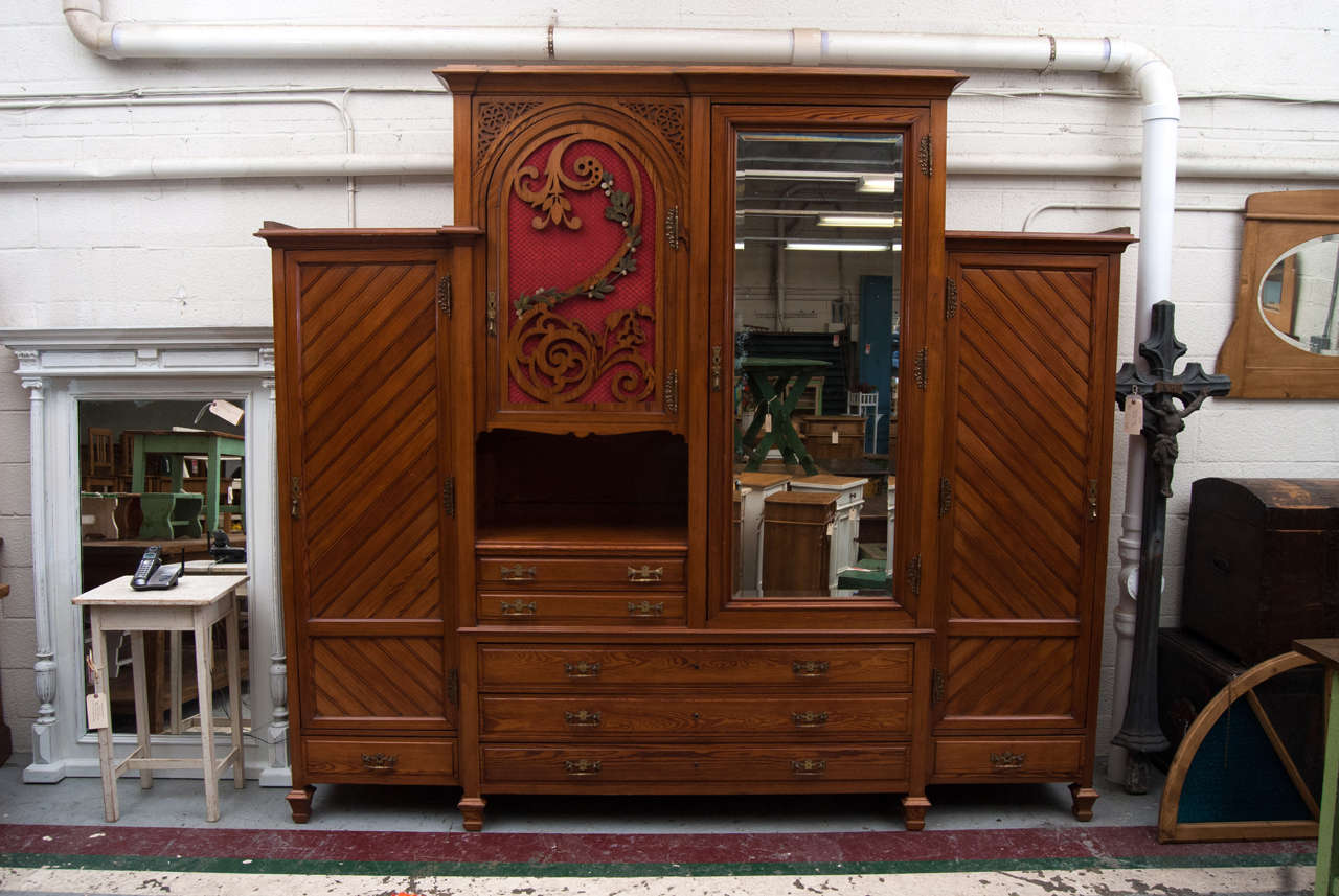 A large and most impressive art nouveau pitch pine armoire featuring a central 
