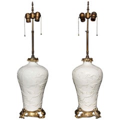 Pair of Chinese Blanc de Chine, French Louis XV Ormolu-Mounted Table Lamps