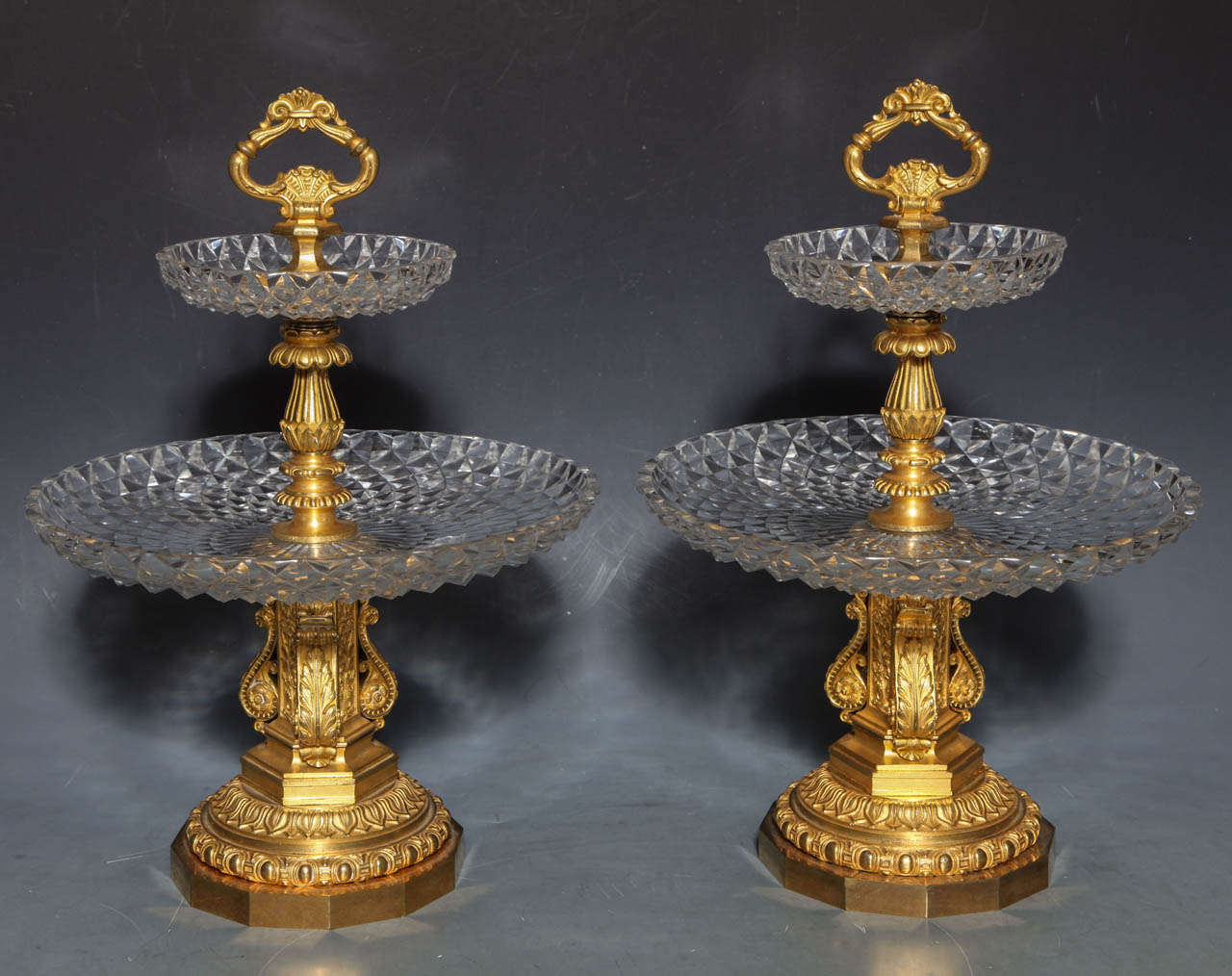 A fine pair of Antique French Neoclassical hand diamond cut Crystal and Dore Bronze Two Tiered Tazzas/Centerpieces, Signed by Pierre-Philippe Thomier (1751–1843). The diamond cut trays sparkle against Dore bronze mounts of the finest quality. The