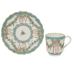 An 18th Century Soft Paste Worcester Hop Trellis Pattern Cup and Saucer