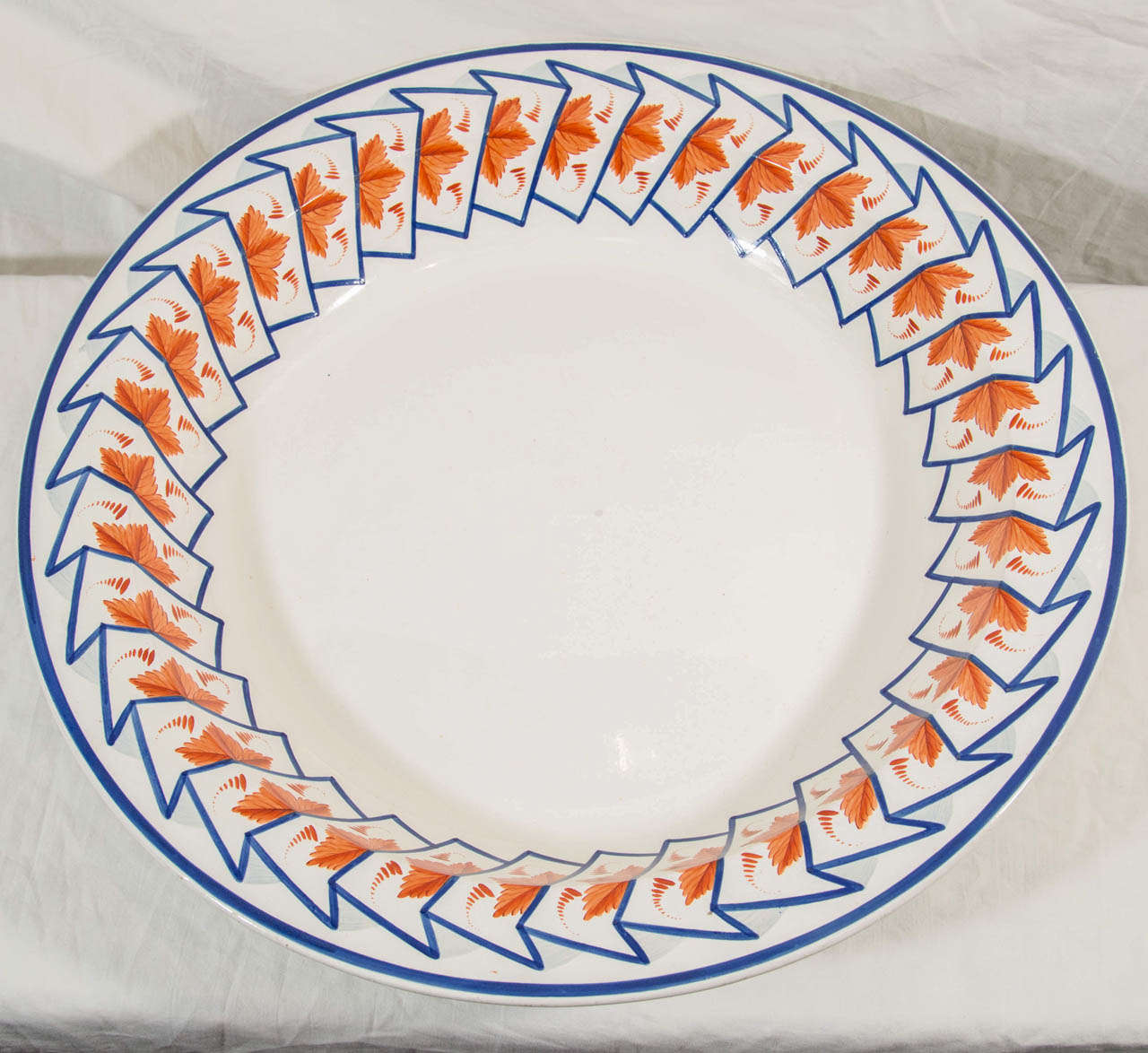 A giant Spode pearlware bowl decorated to the border with cobalt blue accordion folds enclosing orange leaves. This rare pattern has a modern look.
In this pattern we also have in the shop:
A large oval platter, 21.75