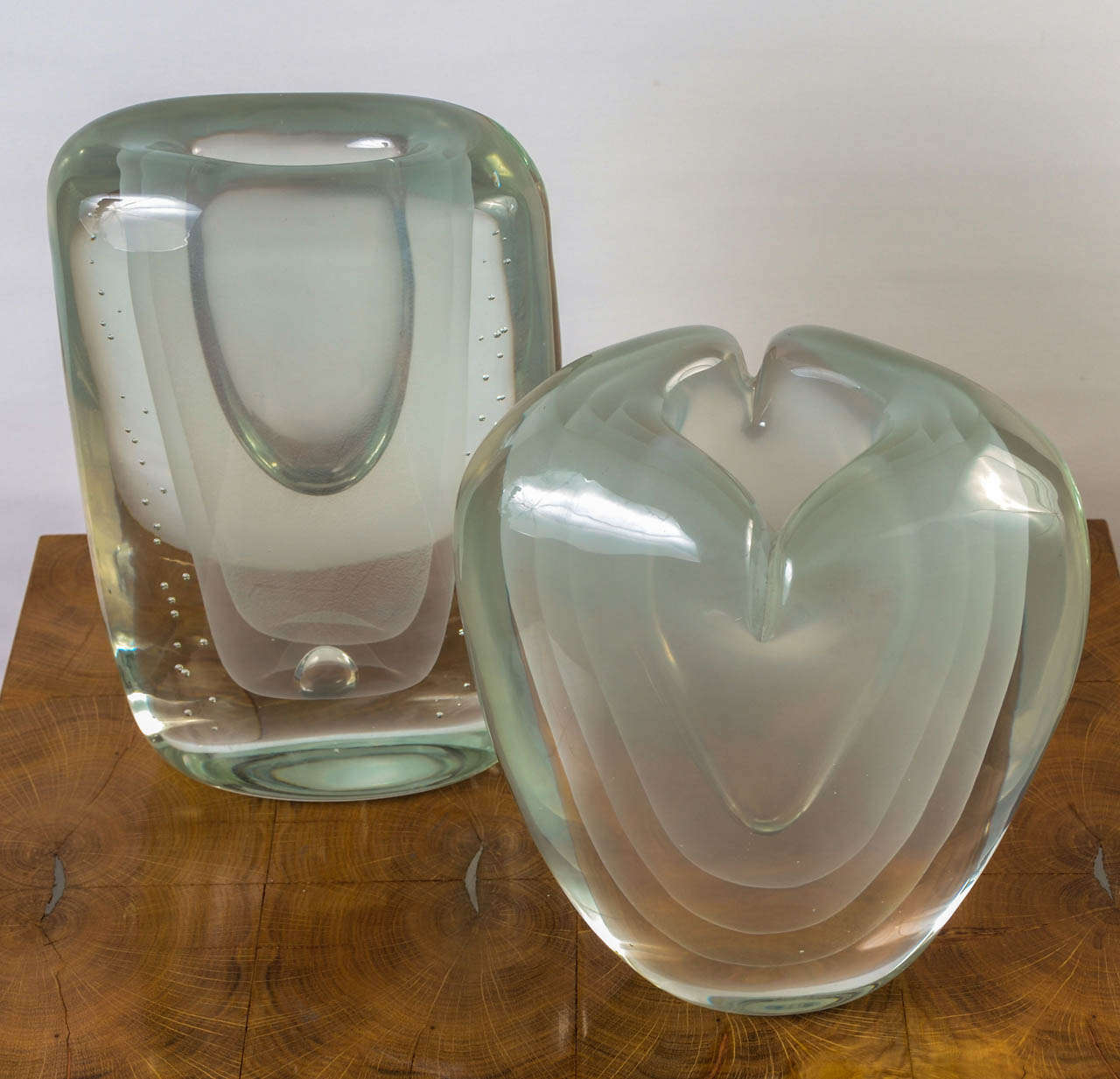 This is a set of two small sea green blown Murano glass vases, very interesting by all the visible layers of glass inside each vases that provide different tints depending on how you are looking at it. Both of the vases are in perfect condition.