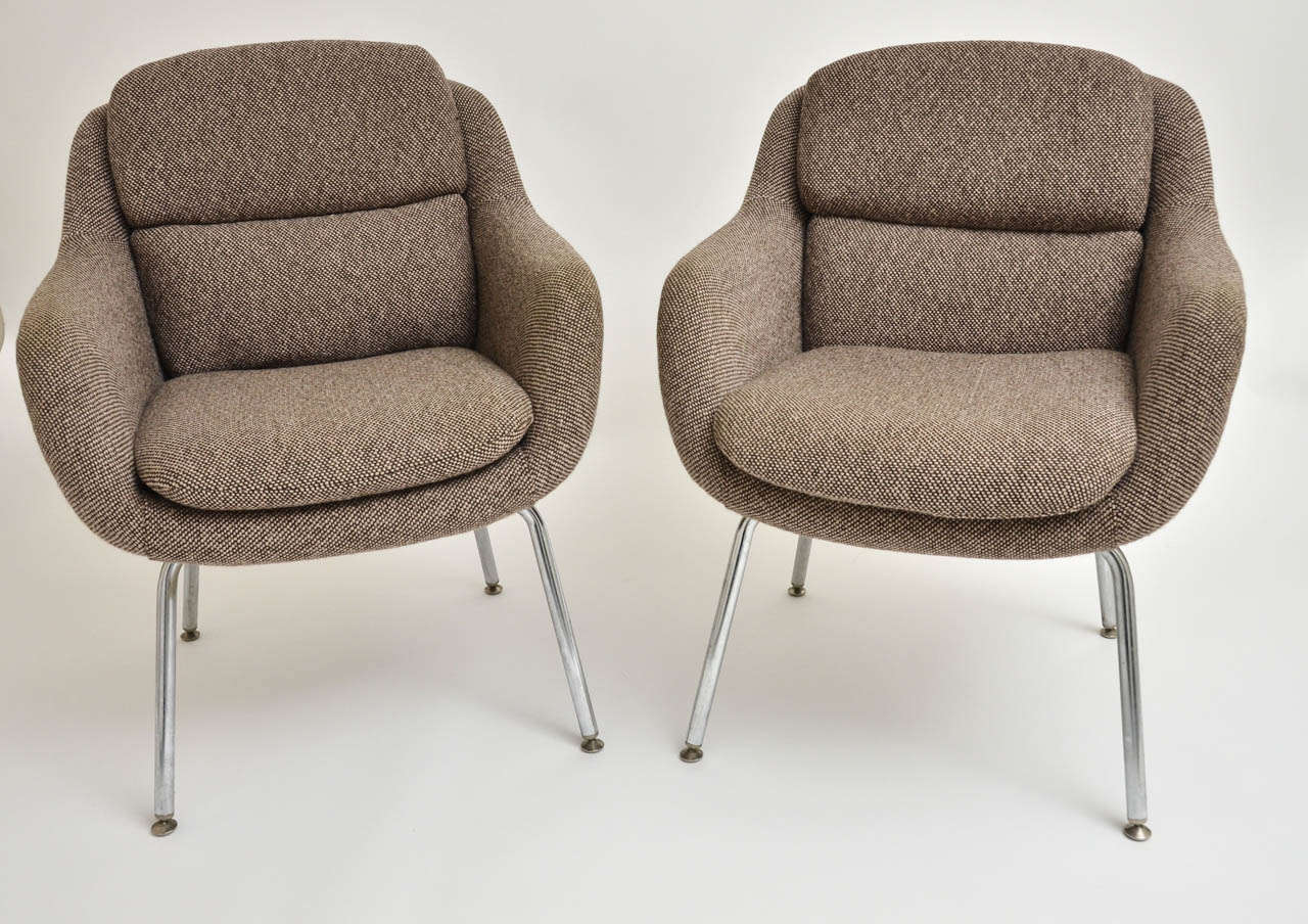 A 1970s pair of upholstered armchairs with chrome legs and original fabric Two pair available.