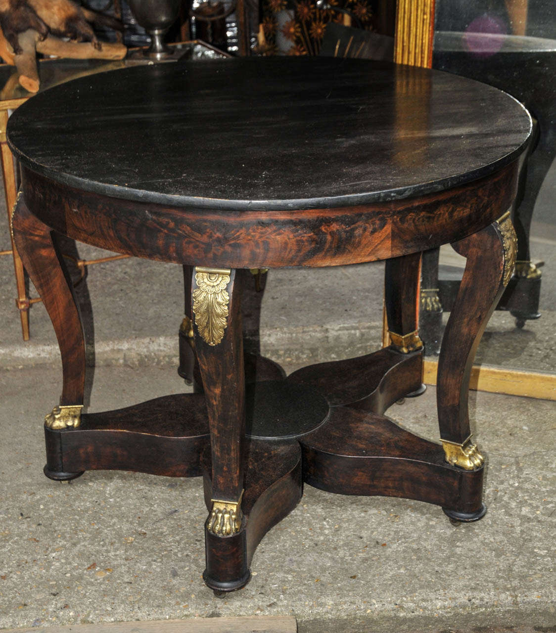 1815 mahogany gueridon. Ebonized wood top. Empire period. Good condition. Normal wear consistent with age and use.