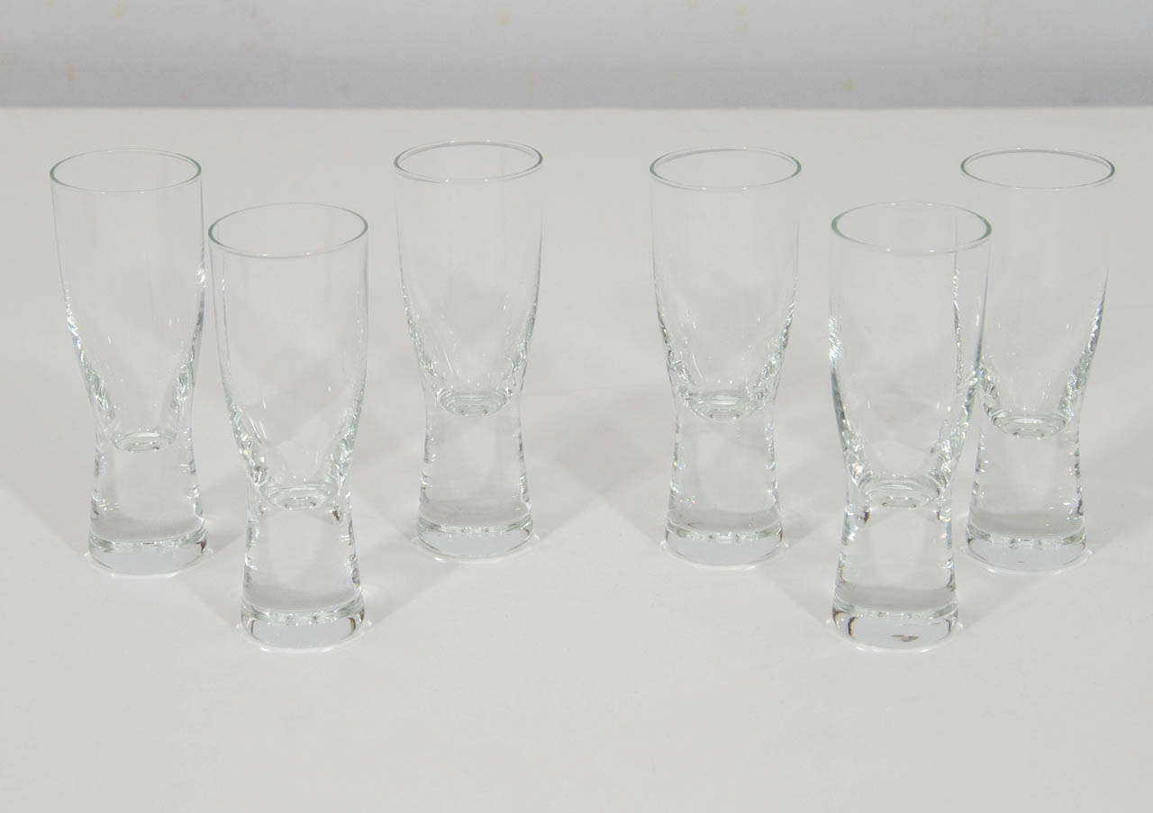 Beautifully designed set of six liqueur glasses by Per Lutken for Holmegaard. The glasses have a weighted bottom and the design is named 