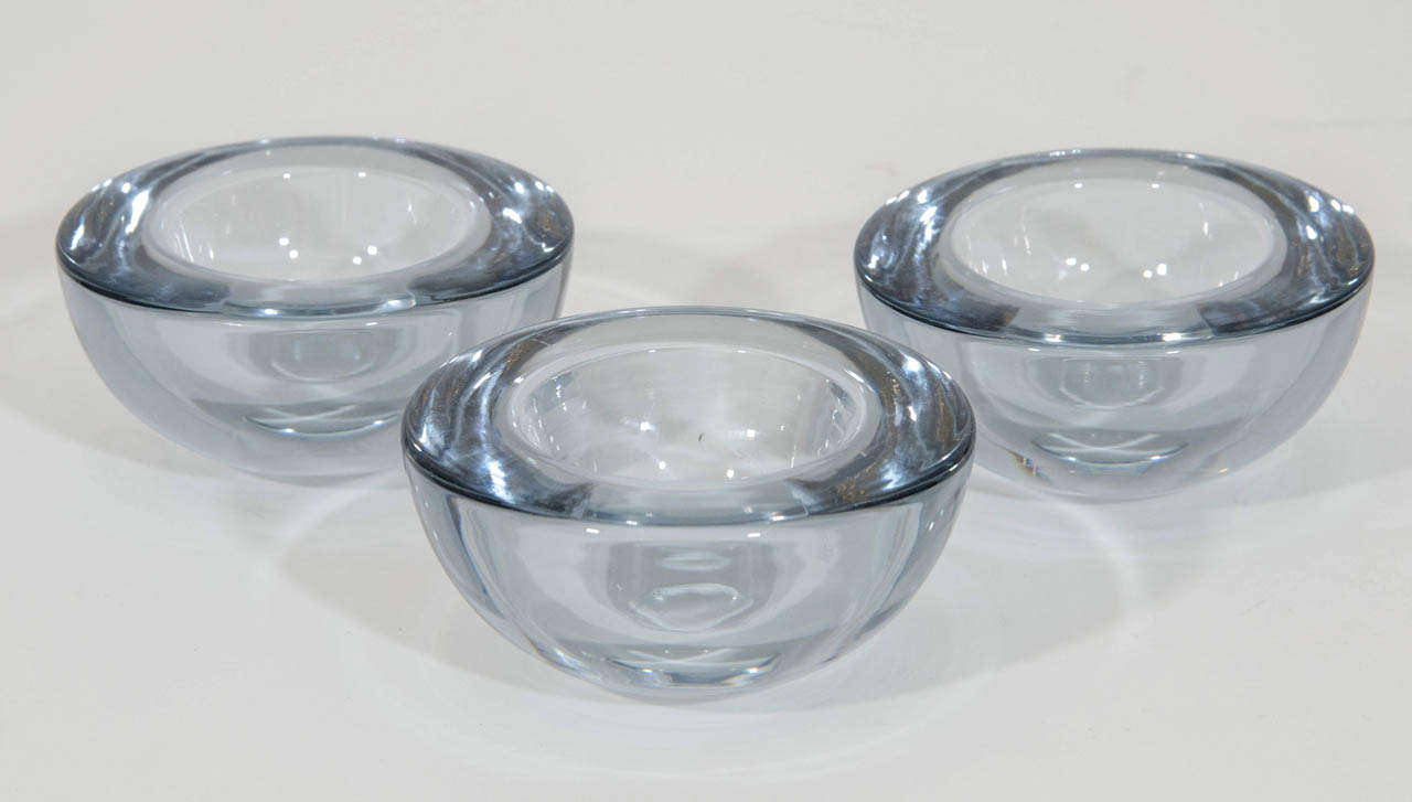 Beautiful set of three decorative accent bowls in an art glass with a silvery tint. Please contact for location.