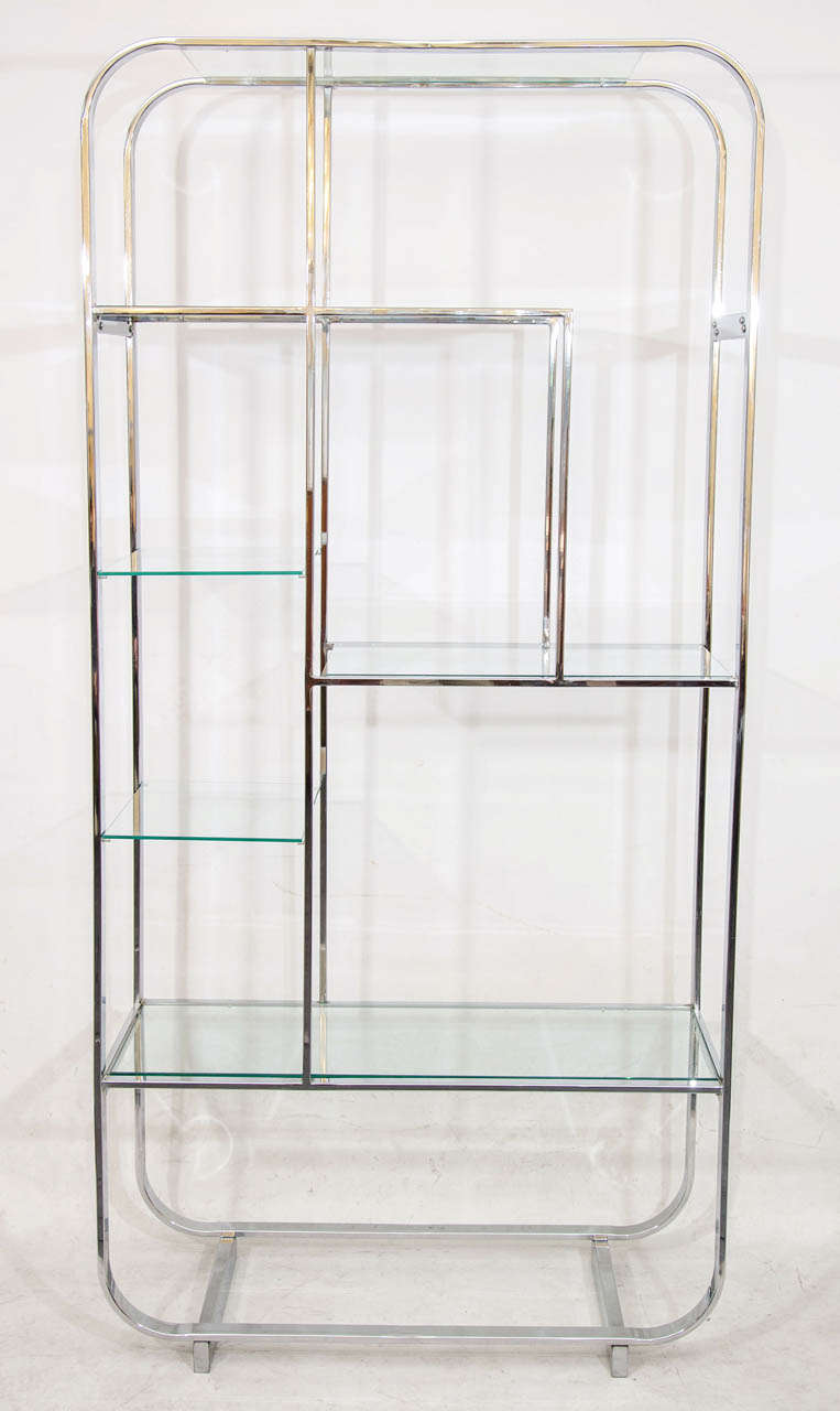 Beautiful chrome and glass étagère with an interesting play of asymmetrical shelves. Please contact for location. Offered by Las Venus by Kenneth Clark, New York City.