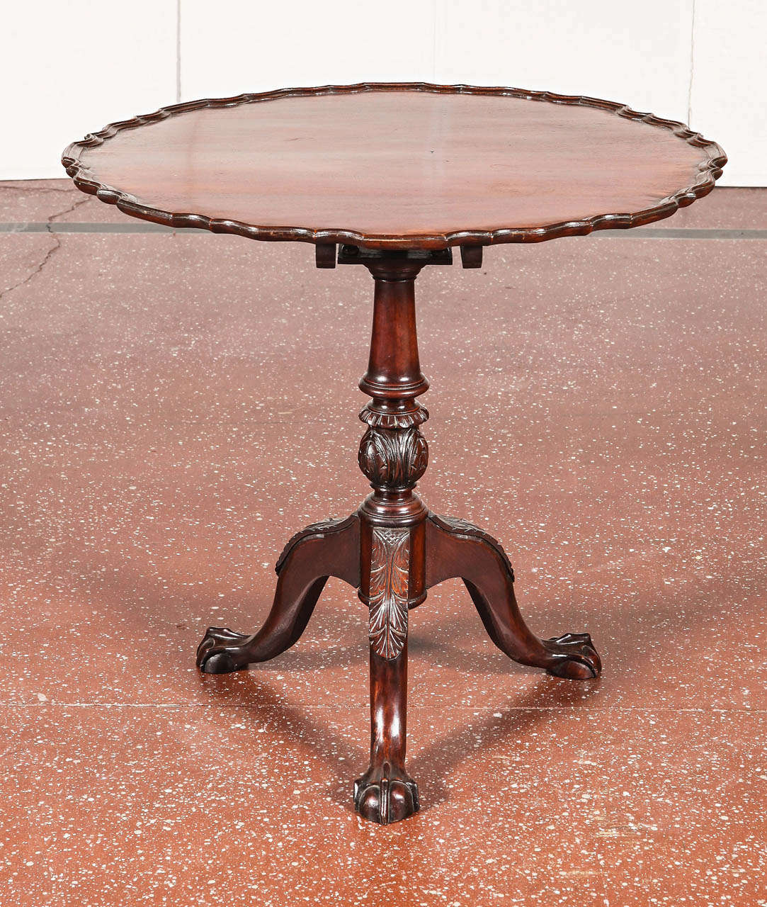 Late 19th c. English mahogany piecrust tilt-top table with tri-pod base.  Ball and talon feet.