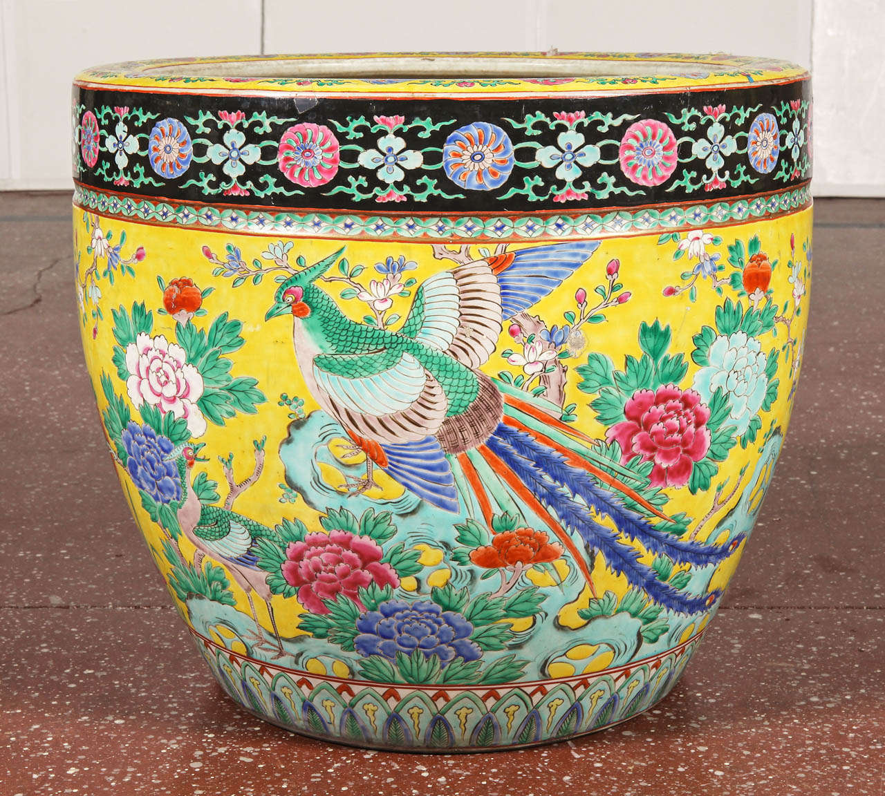 Japanese monumental fish bowl planter with yellow ground and multi-colored peonies, birds and leaves.  Marked Nippon.  Circa 1900.