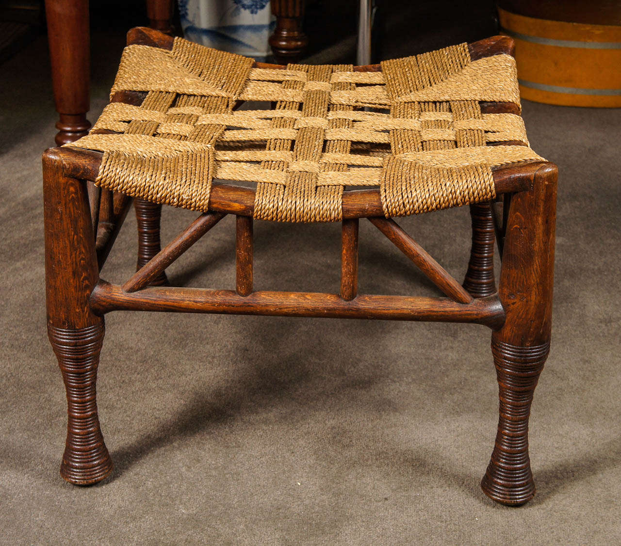 Large and unusual Liberty and Company oak stool with roping.