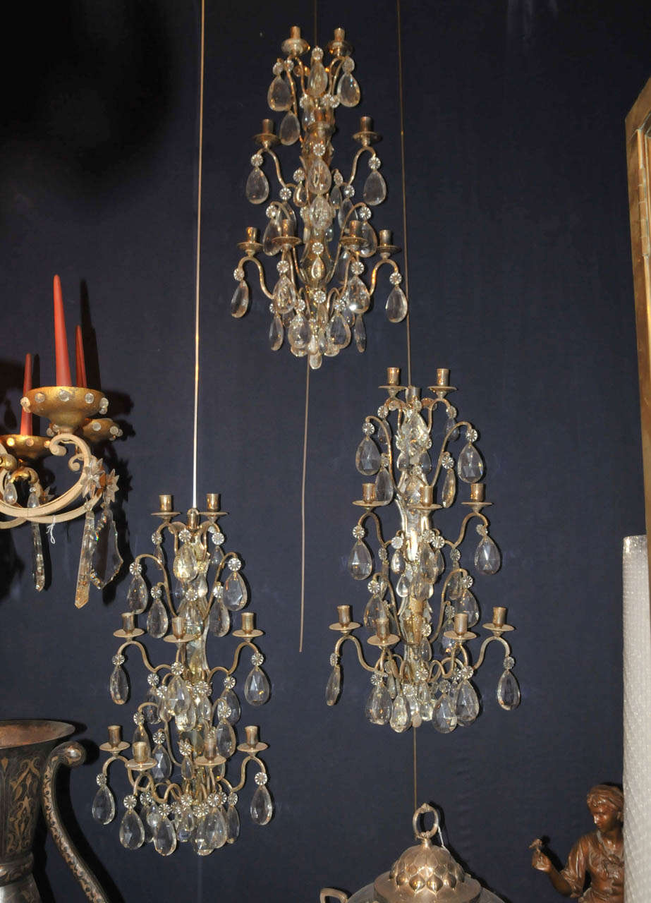 Set of four 1880 Napoleon III sconces in silvered metal and cristal. Ten arms per sconce. No wiring. Very good condition. Normal wear consistent with age and use.